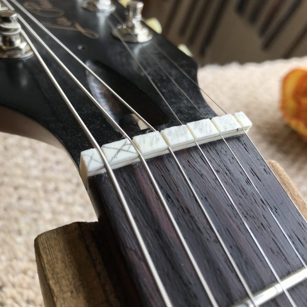 guitar nut, electric guitar setup, truss rod adjustment